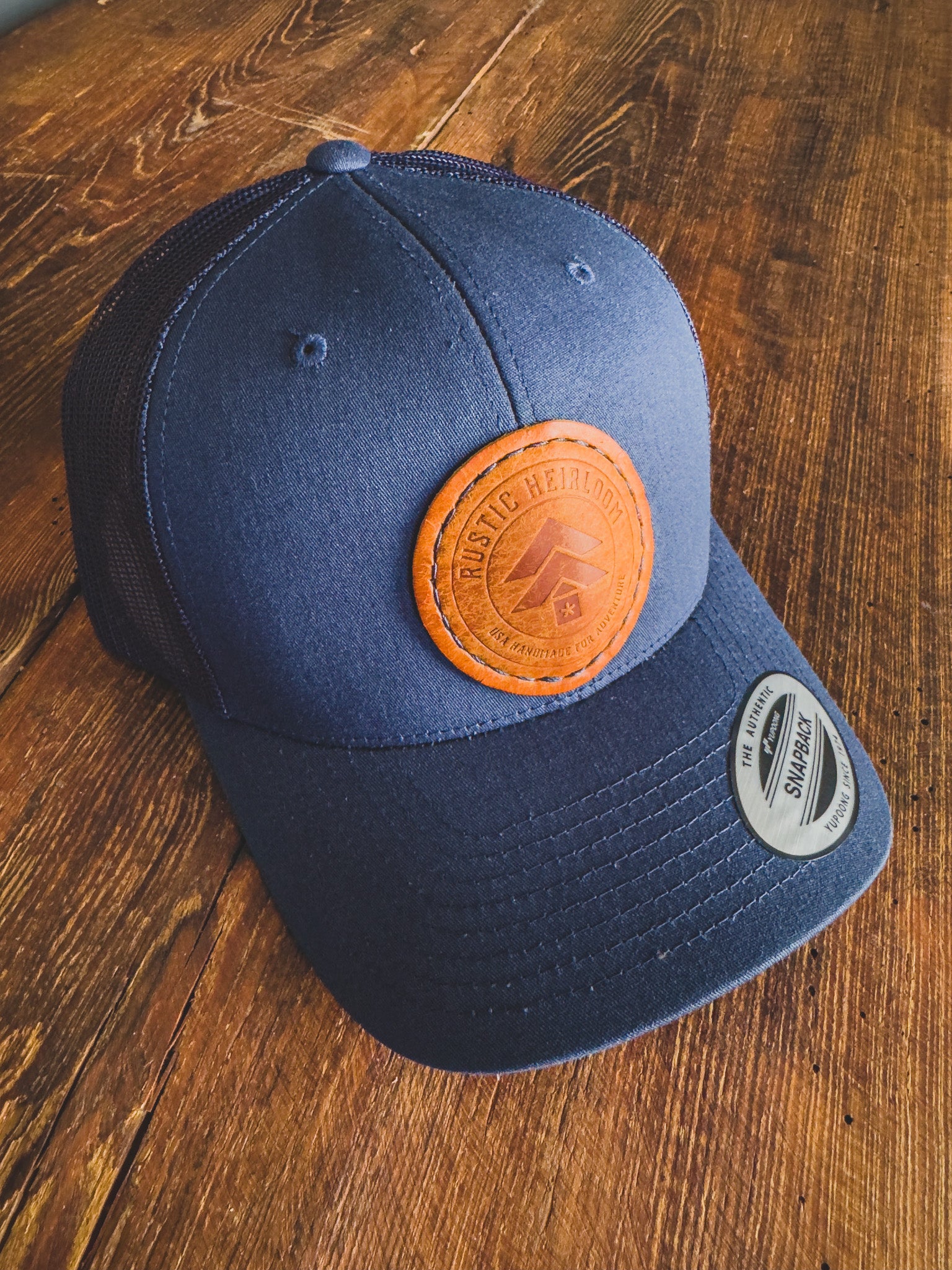 Heirloom Trucker Hat W/Round Leather Patch