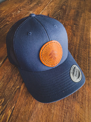 Heirloom Trucker Hat W/Round Leather Patch