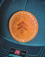 Heirloom Trucker Hat W/Round Leather Patch